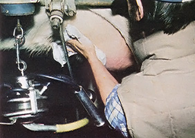 Begin the milking procedure with a thorough cleaning of the cow's udder.